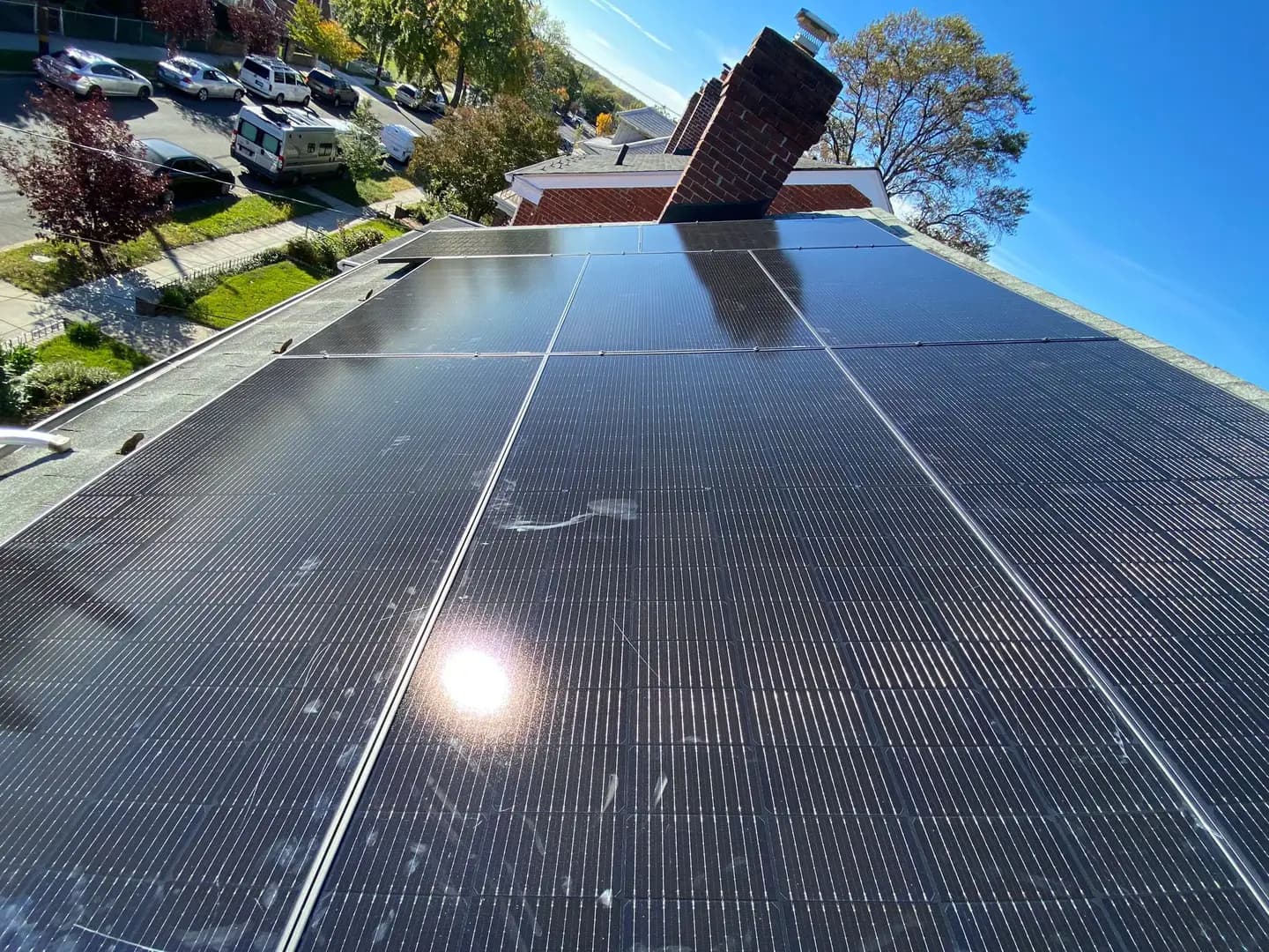 Aduu Solar technician inspecting rooftop solar panels